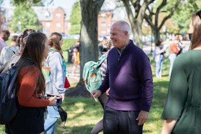 President Kaufman Talking With A Student